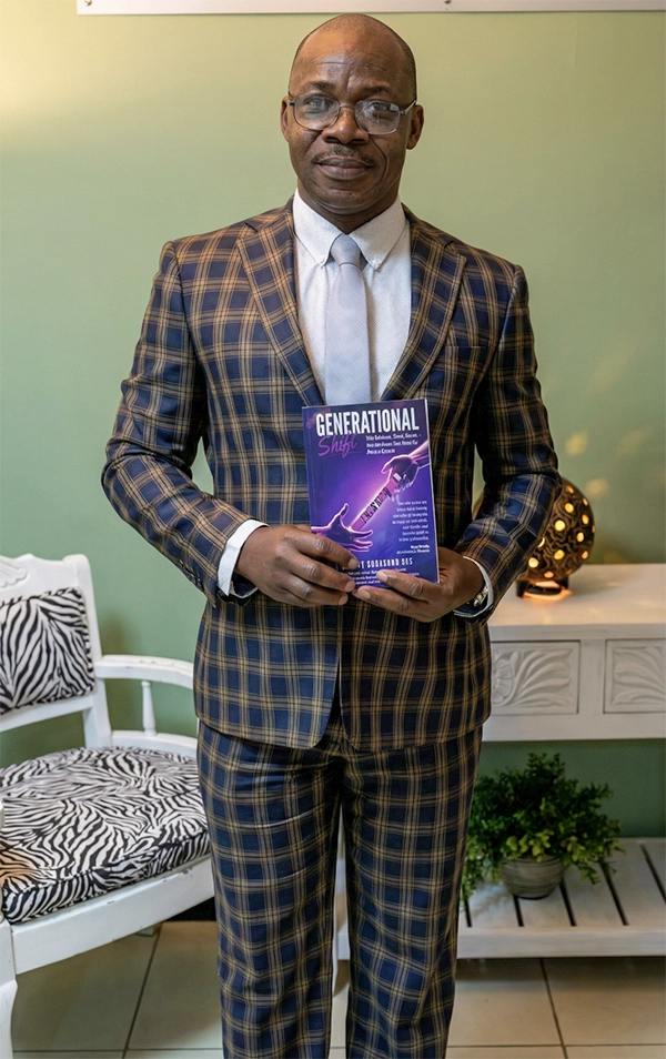 Kenety Gee holding his book Generational Shift